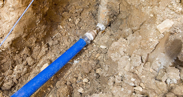 A water line properly installed in the ground.